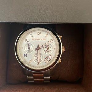 Rose gold and stainless steel Michael Kors watch.  Used and very little wear.